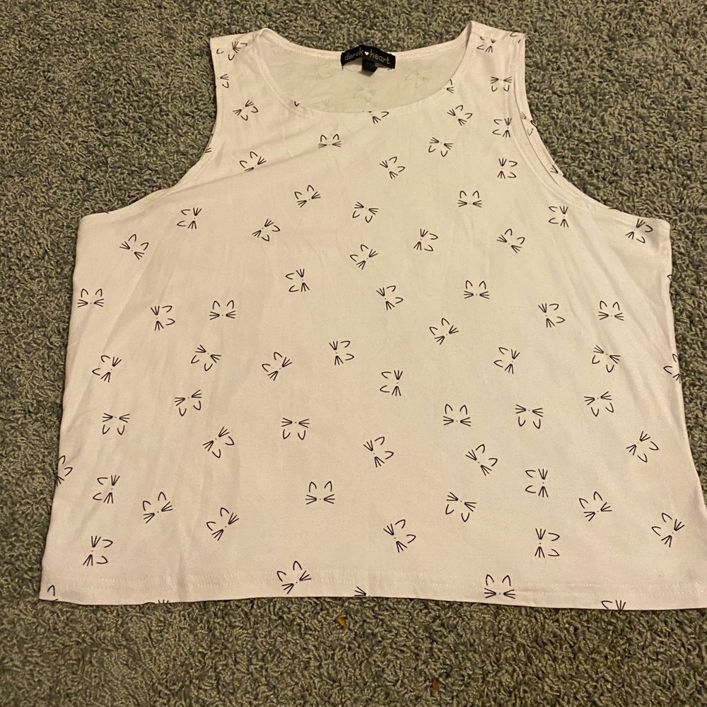 White shirt with black cats on it